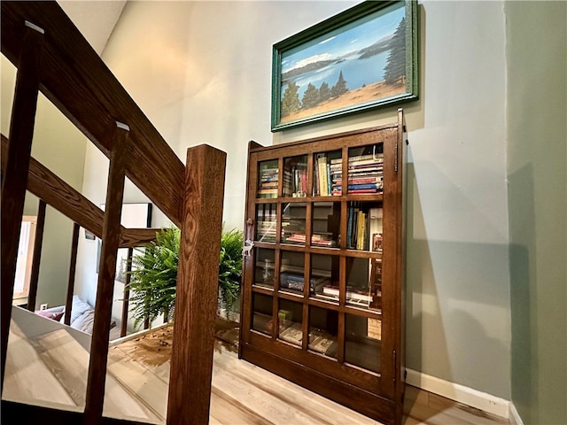 hall featuring french doors and hardwood / wood-style flooring