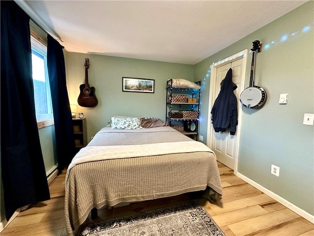 7 Pinewood Ln, South Bristol, NY 14512 - bedroom featuring light wood finished floors and a baseboard radiator