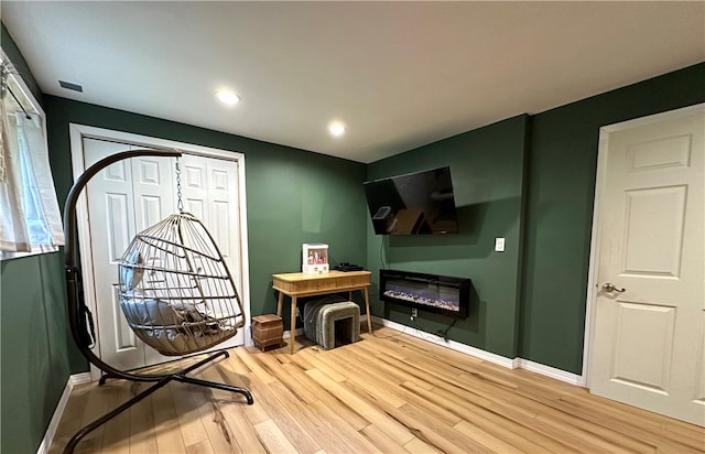 recreation room featuring hardwood / wood-style flooring