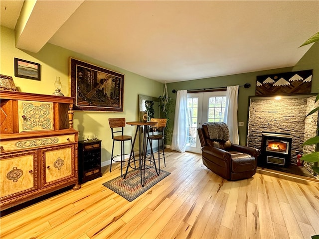 living area featuring a fireplace and light hardwood / wood-style flooring