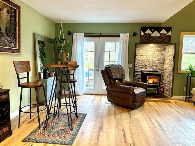 sitting room with light hardwood / wood-style flooring and french doors