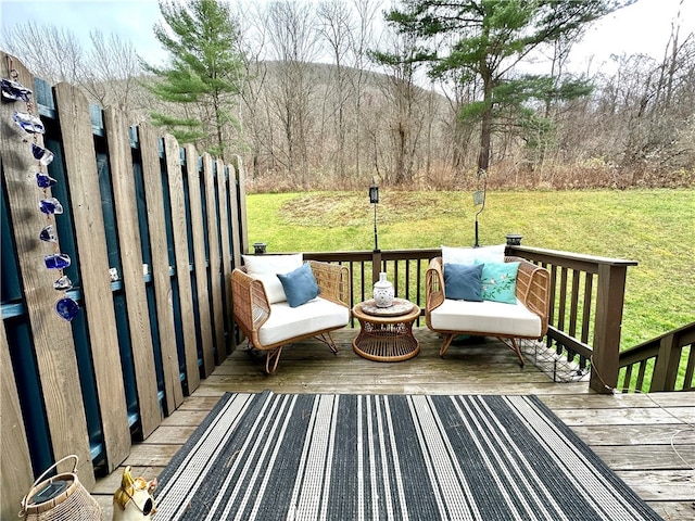 wooden terrace with a lawn