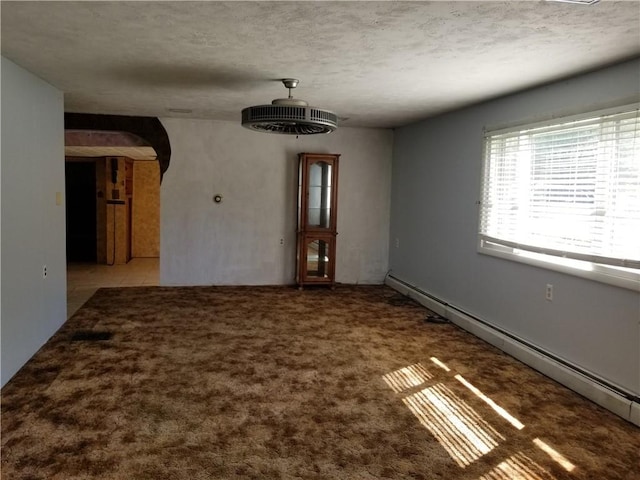 interior space with a baseboard radiator, arched walkways, a textured ceiling, and light colored carpet