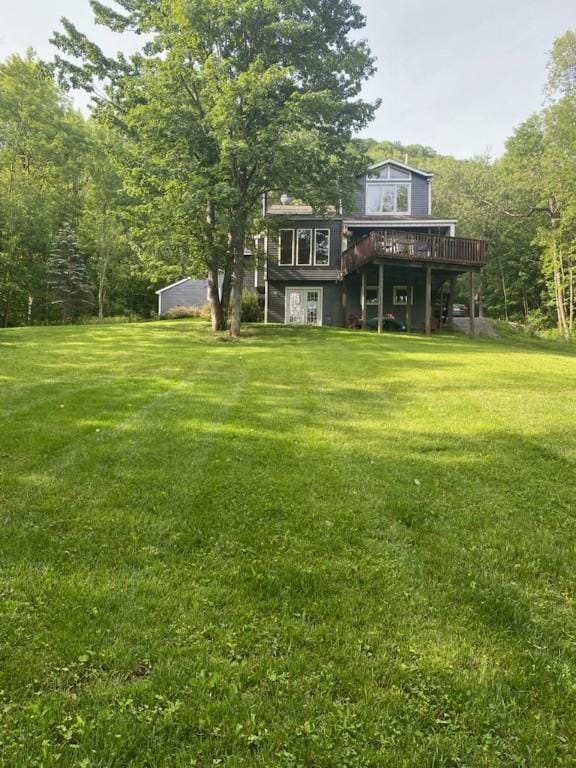 view of yard with a wooden deck