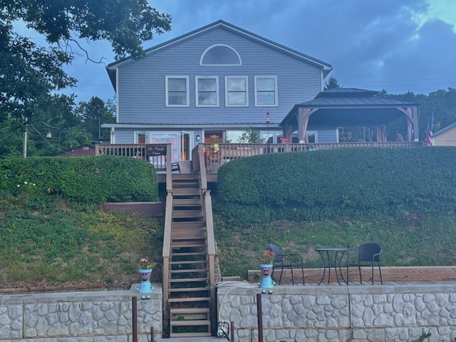 view of front of house featuring a gazebo and a wooden deck