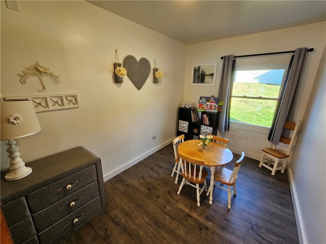 dining area featuring dark hardwood / wood-style flooring