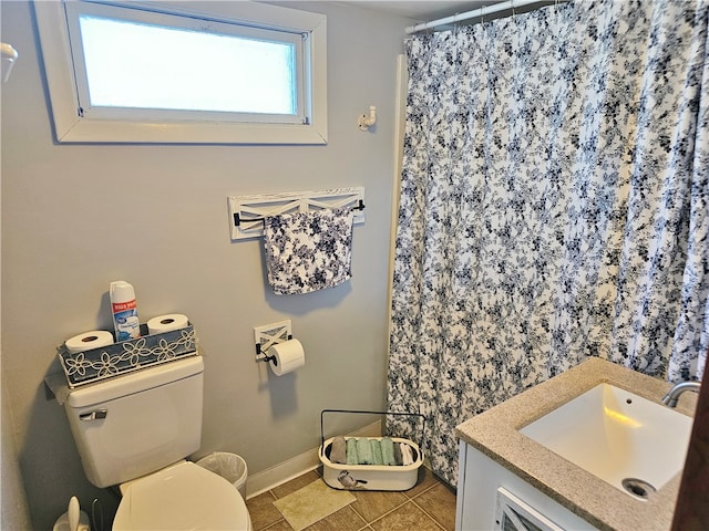 bathroom with tile patterned flooring, a shower with curtain, toilet, and sink