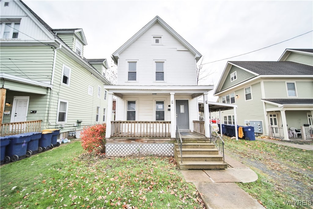 view of front facade featuring a porch and a front lawn