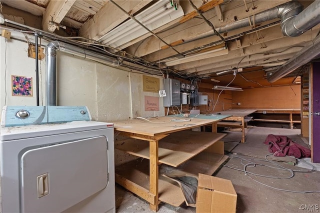 basement with a workshop area and washer / dryer