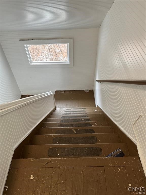 stairs featuring hardwood / wood-style flooring