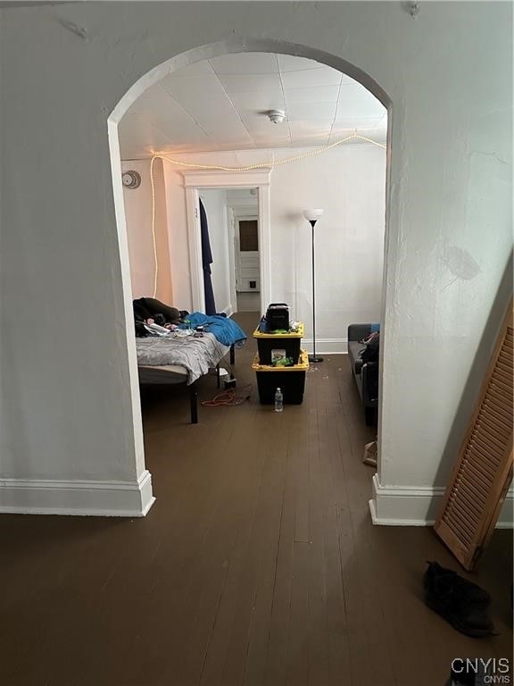 hallway featuring dark hardwood / wood-style flooring