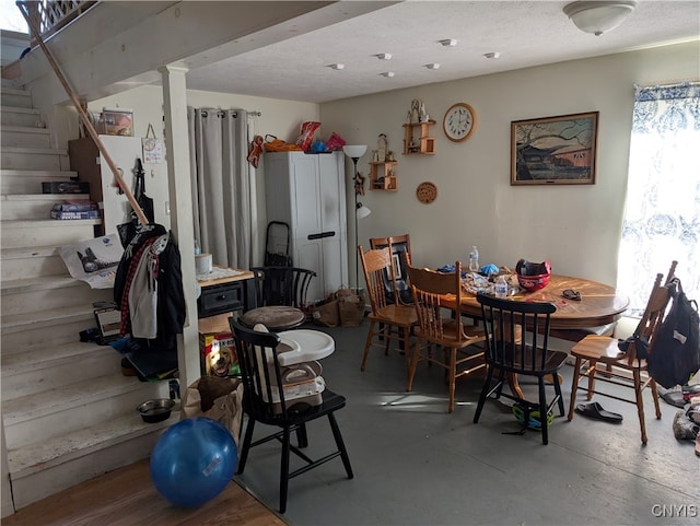 dining area featuring concrete floors