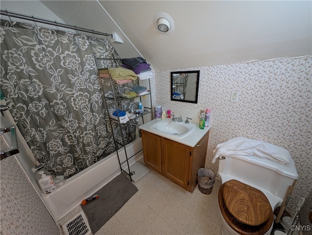 full bathroom featuring shower / bath combo with shower curtain, vanity, toilet, and lofted ceiling