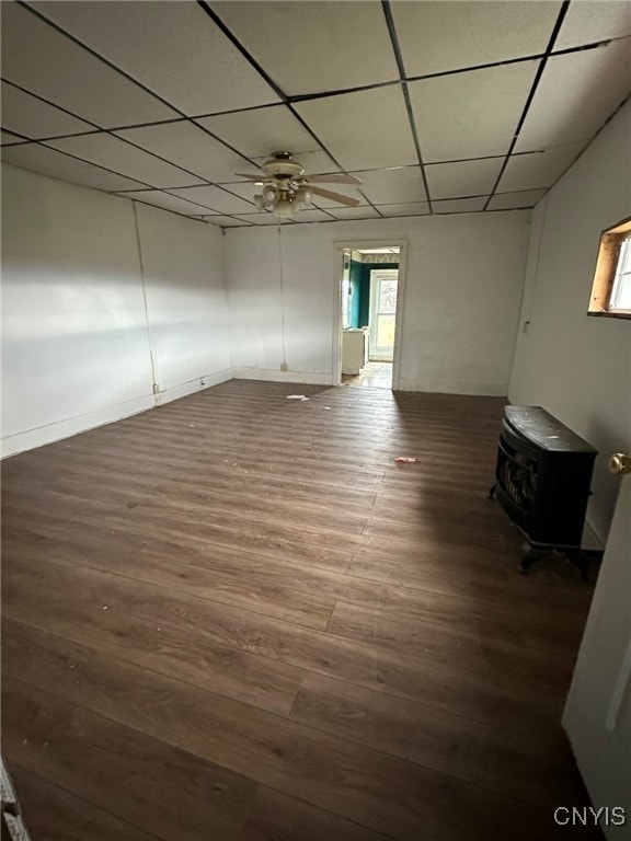 spare room with a paneled ceiling, a wealth of natural light, ceiling fan, and dark hardwood / wood-style floors