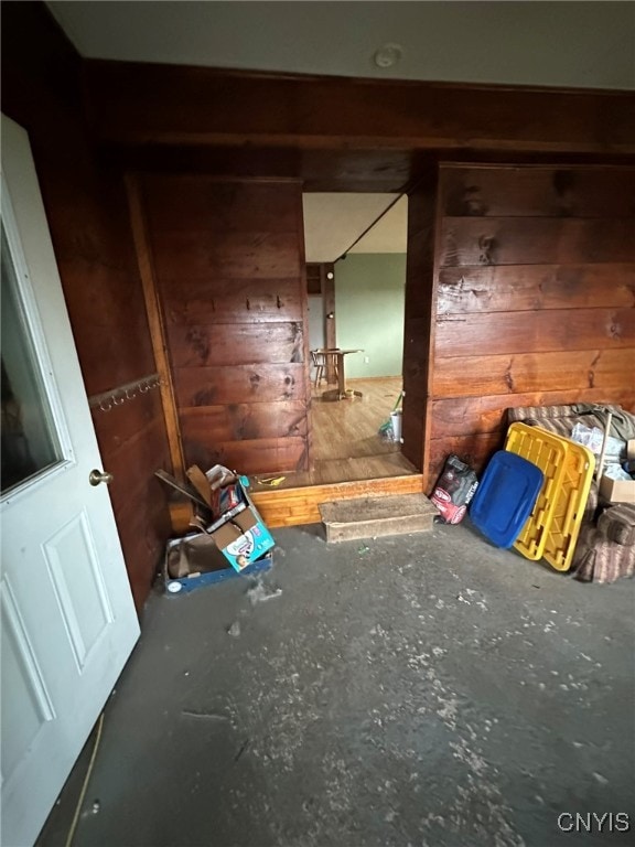 interior space featuring wood walls