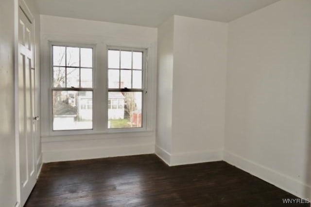 empty room featuring dark hardwood / wood-style floors