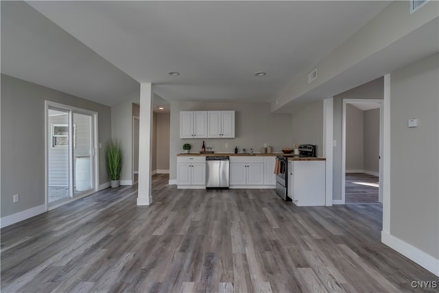 kitchen featuring white cabinets, sink, stainless steel appliances, and light hardwood / wood-style flooring