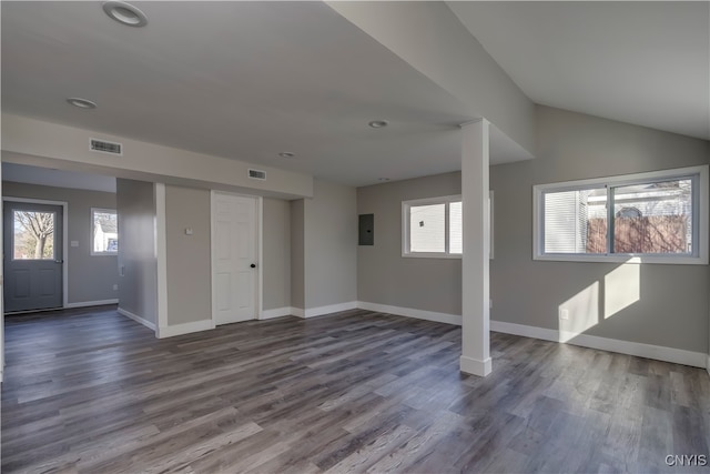 basement with electric panel and hardwood / wood-style flooring