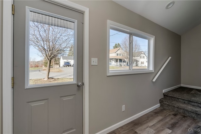 doorway to outside with a wealth of natural light and hardwood / wood-style floors