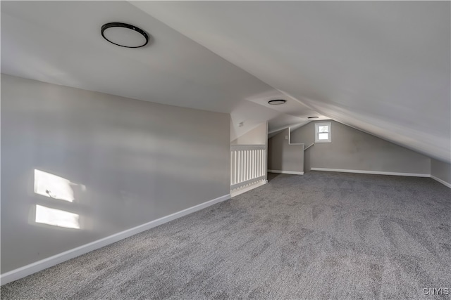 additional living space with carpet and vaulted ceiling