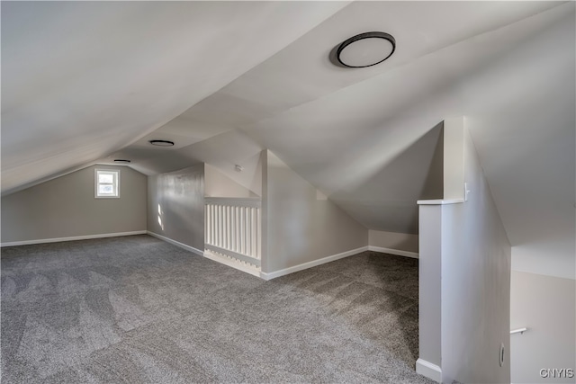 bonus room featuring carpet and lofted ceiling