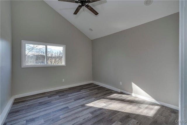 empty room with wood-type flooring, high vaulted ceiling, and ceiling fan