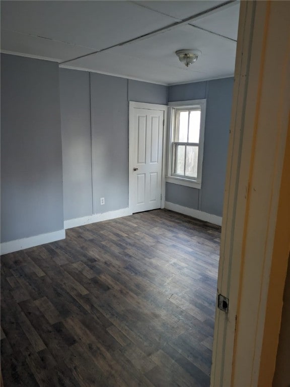 spare room featuring dark hardwood / wood-style floors