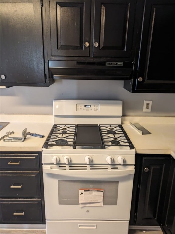 kitchen with white gas stove