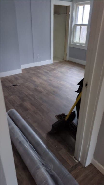 stairs with hardwood / wood-style flooring