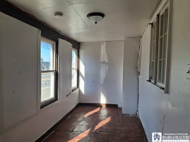 empty room featuring dark parquet floors