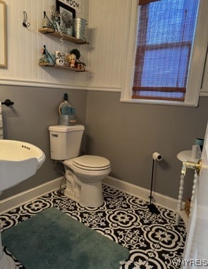 bathroom with tile patterned flooring and toilet