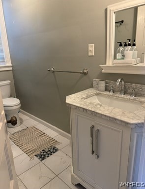 bathroom with vanity and toilet