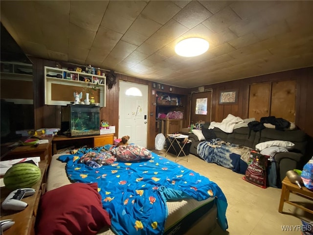 bedroom with wooden walls