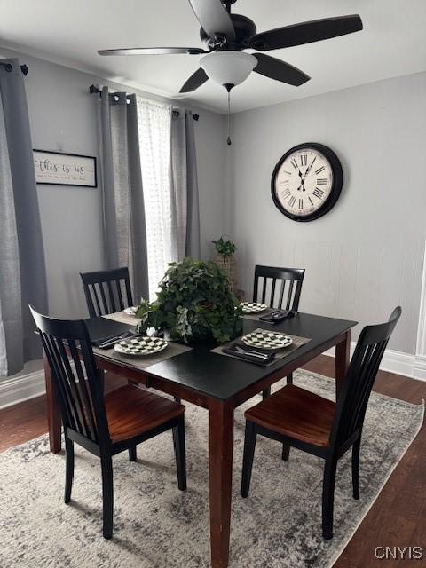 dining space featuring hardwood / wood-style flooring and ceiling fan