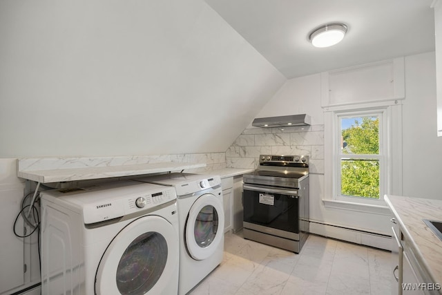 laundry room featuring washer and dryer and a baseboard radiator