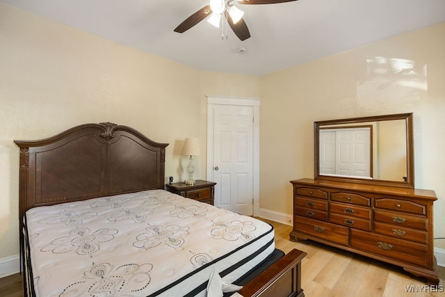 bedroom with ceiling fan and light wood-type flooring