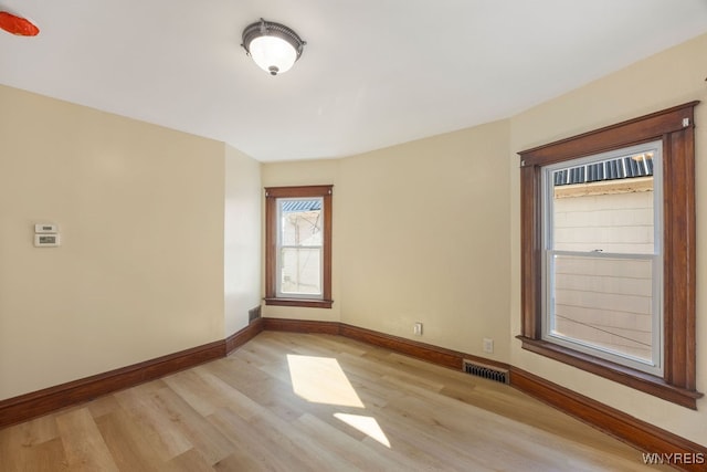 spare room with light wood-type flooring