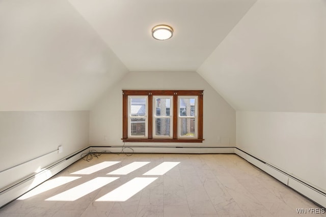 bonus room with baseboard heating and vaulted ceiling