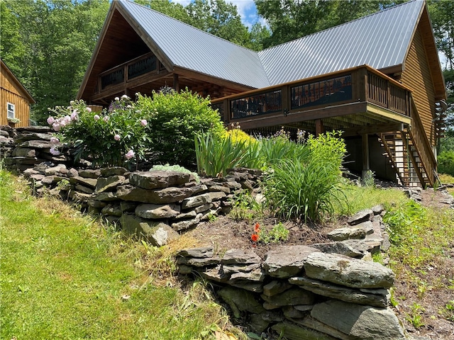 view of side of property with a wooden deck