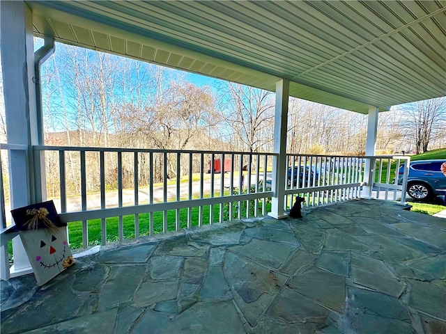 wooden terrace with a porch