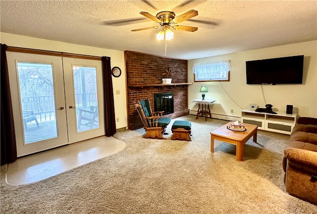 living room featuring a baseboard heating unit, a fireplace, french doors, and carpet flooring