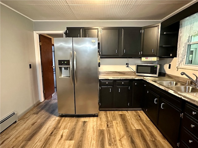 kitchen with light hardwood / wood-style floors, sink, a baseboard heating unit, and stainless steel appliances