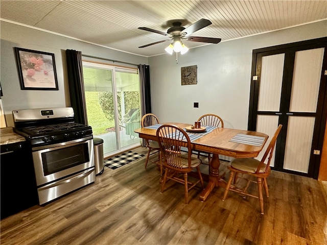 dining space featuring wood-type flooring, wooden ceiling, and ceiling fan