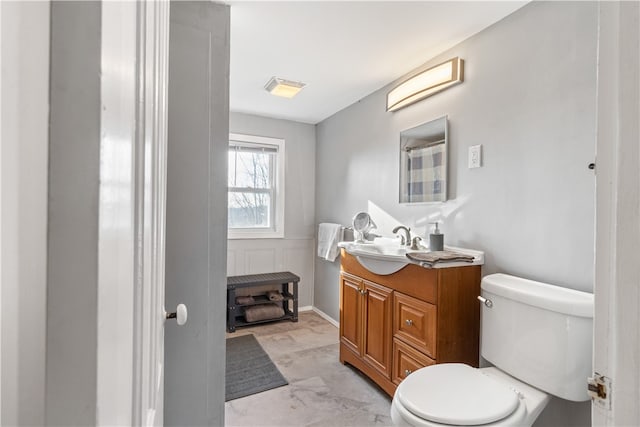 bathroom featuring vanity and toilet