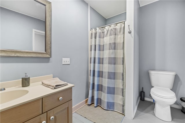 bathroom featuring curtained shower, tile patterned flooring, vanity, and toilet