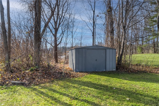 view of outbuilding with a lawn