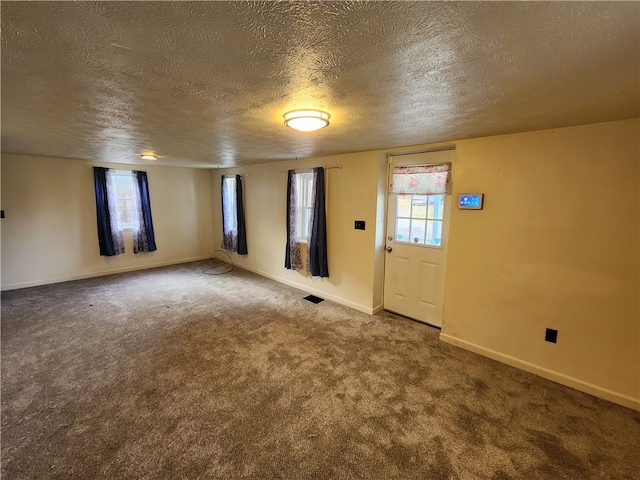 interior space with a textured ceiling