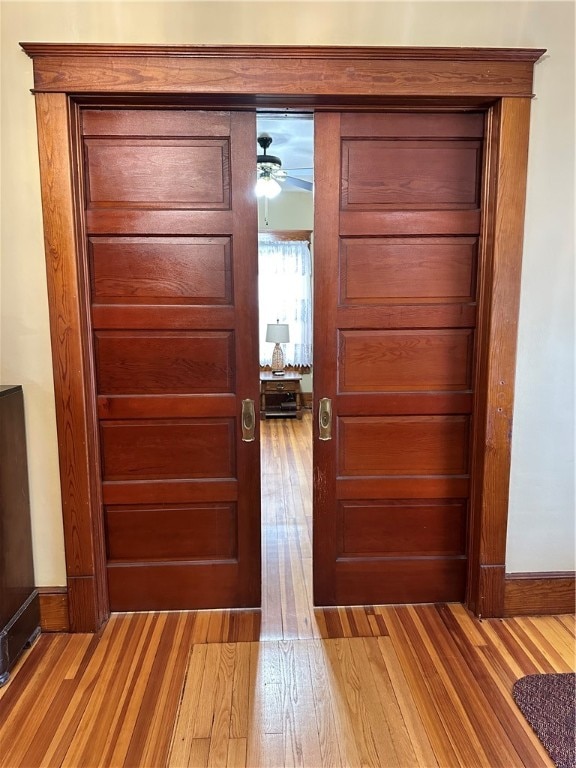 foyer entrance featuring ceiling fan and light hardwood / wood-style floors