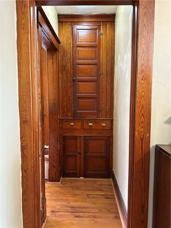 hallway with light wood-type flooring