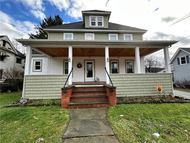 bungalow-style house with a front lawn